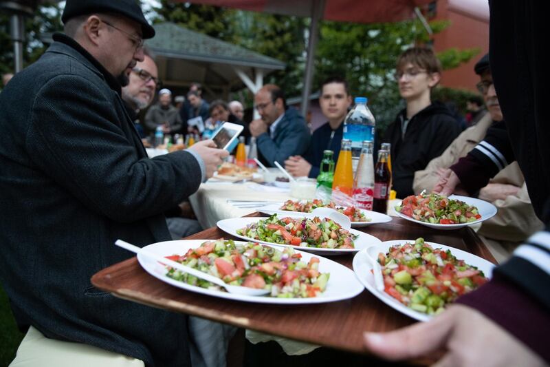 People from the House of One gather for iftar in Berlin, Germany.  EPA