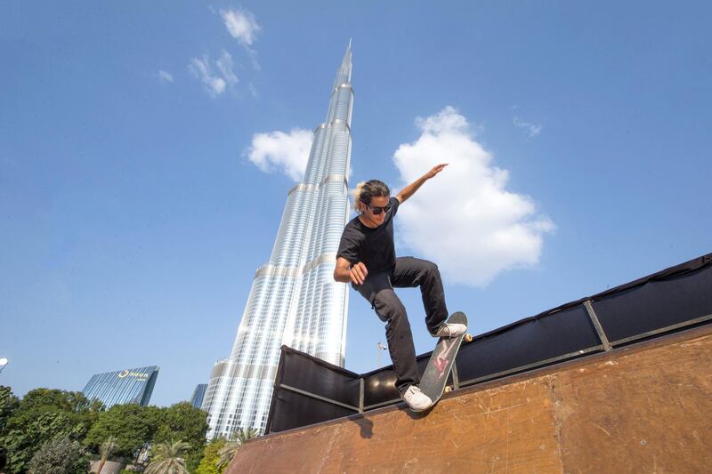 DUBAI, UNITED ARAB EMIRATES - A professional skateboarder doing stunt at the closing weekend carnival of the second year of the Dubai Fitness Challenge at Burj Park, Dubai.  Leslie Pableo for The National