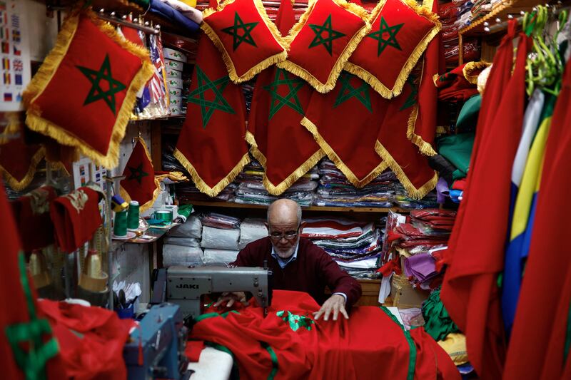 Stitching a Moroccan flag at Rabat's Medina