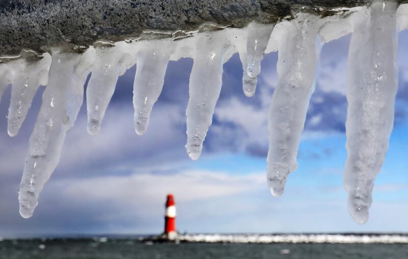 Icicles photographed in the Baltic Sea harbour of Warnemuende, near Rostock, eastern Germany. Bernd Wuestneck / dpa via AP