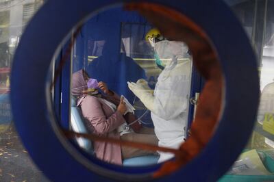 Vaccinated travellers need a negative PCR test before flying to Morocco. February 7, 2022. Photo by TIMUR MATAHARI / AFP