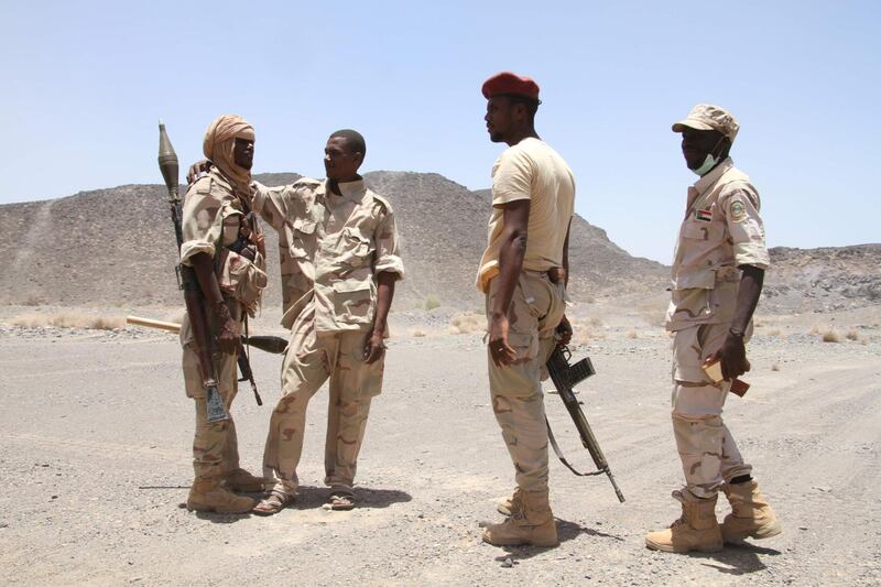 (FILES) In this file photo taken on April 12, 2017 Sudanese soldiers patrol outside the west of the Yemeni coastal port town of Mokha.
Although Sudan has vowed to remain in the Saudi-led coalition fighting rebels in Yemen, calls for Khartoum to withdraw its troops from the war-torn country have increased after a deadly ambush.
 / AFP PHOTO / SALEH AL-OBEIDI