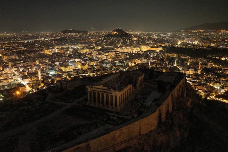 A drone view shows the ruins of the ancient Parthenon temple atop the Acropolis hill with the lights turned off during Earth Hour, in Athens, Greece. Reuters