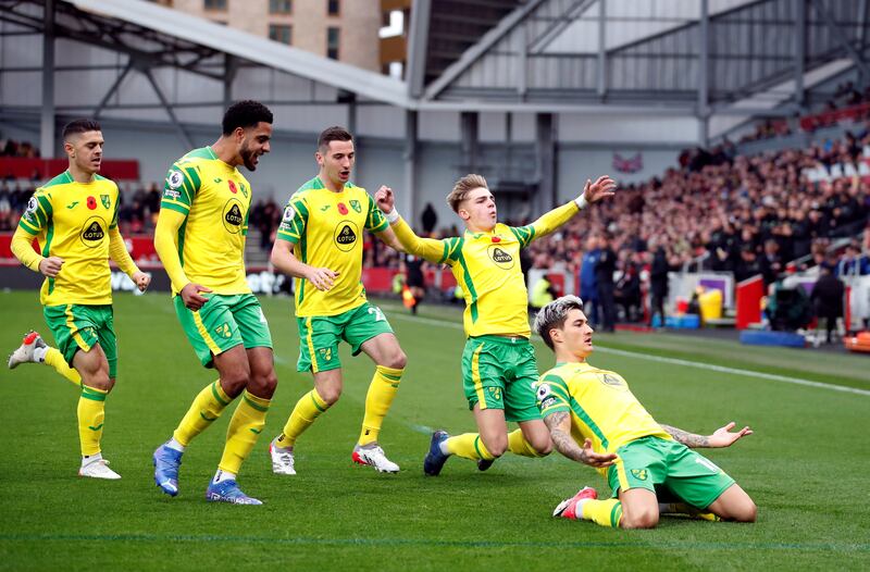 Norwich City's Mathias Normann celebrates scoring their first goal with teammates. Reuters