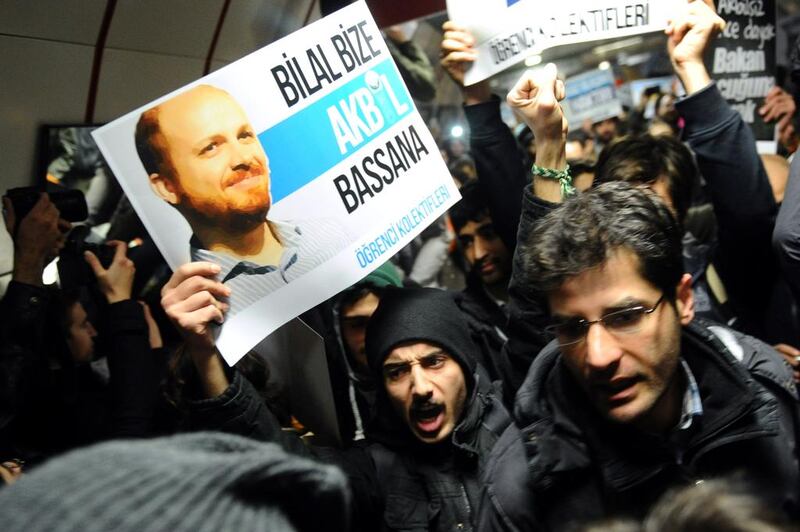 A protester holds up a poster with a picture of the Turkish prime minister's son, Bilal Erdogan, during a demonstration against corruption and the government in Istanbul last week. Ozan Kose / AFP