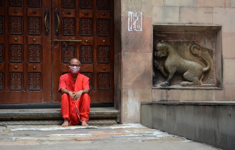 The President of Kamakhya Temple Committee in front of the main entrance gate of Kamakhya temple. AFP