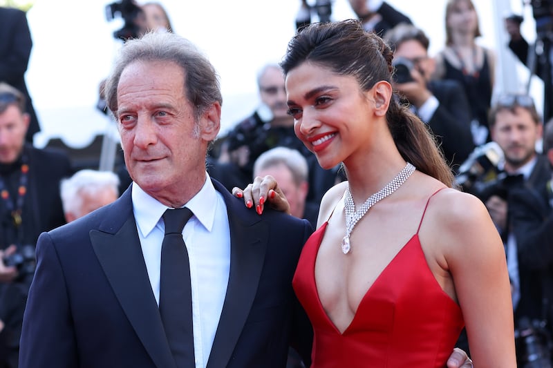 Padukone with jury president, actor Vincent Lindon on the red carpet. Getty Images