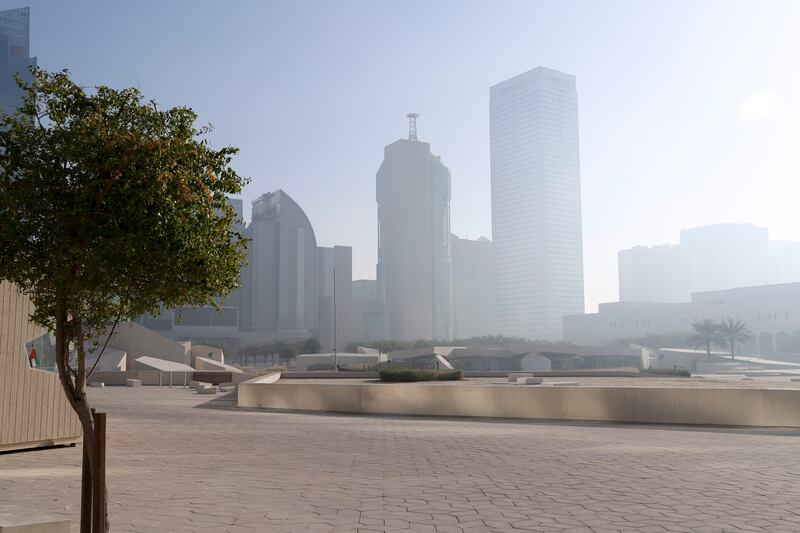 Fog drifts across Qasr Al Hosn. The National Centre of Meteorology issued an alert as the murky weather descended over most of the coastline, stretching deep inland. Khushnum Bhandari / The National