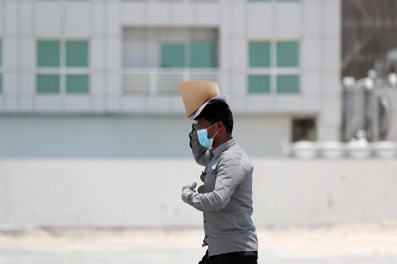 Dubai, United Arab Emirates - Reporter: N/A. Coronavirus/Covid-19/Weather. A man shields his face from the sun on a hot day in Al Barsha. Sunday, June 7th, 2020. Dubai. Chris Whiteoak / The National