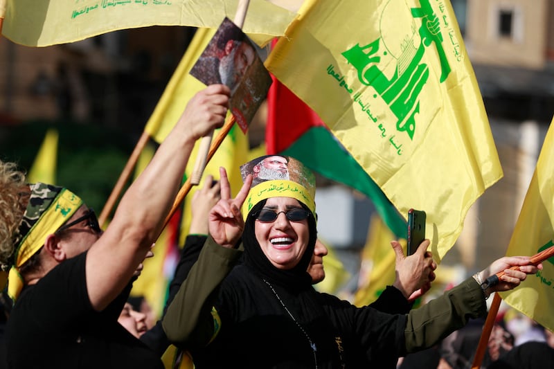 Hezbollah supporters at a rally in southern Beirut, ahead of Mr Nasrallah's speech. AFP