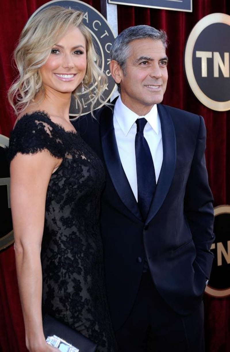 Actors George Clooney (R) and Stacy Keibler arrive at the 18th Annual Screen Actors Guild Awards at The Shrine Auditorium on January 29, 2012 in Los Angeles, California.   Kevork Djansezian/Getty Images/AFP