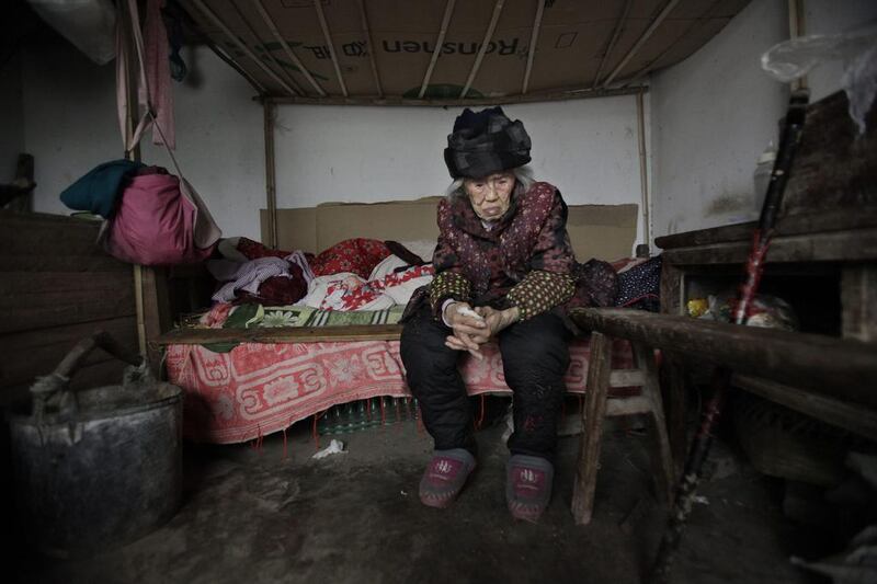 Zhang Zefang, a 94-year-old woman who sued her own children for not taking care of her, in the garage of her family's house in Fusheng Village, east of Chongqing City. Eugene Hoshiko / AP