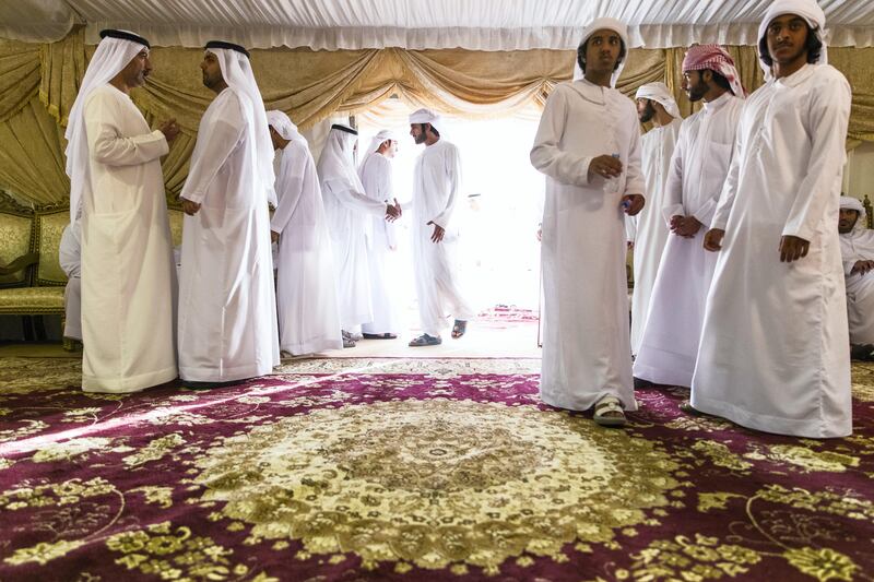 Al Ain, United Arab Emirates, August 13, 2017:    Men gather to pay their respects to the family of Captain Ahmed Khalifa Al Baloushi, 27, a UAE soldier who died in a helicopter crash while serving in Yemen,at a majalis outside the Al Towayya mosque in the Al Towayya area of Al Ain on August 13, 2017. Christopher Pike / The National

Reporter: Nawal Al Ramahi
Section: News