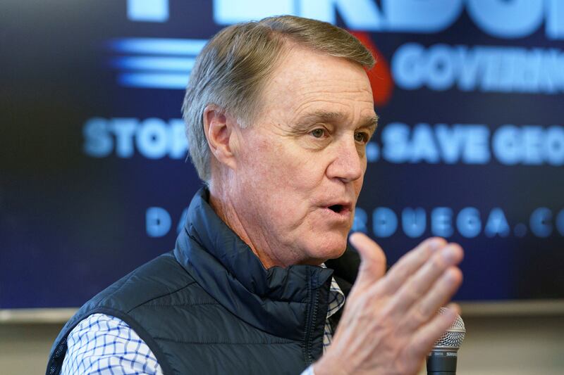 Former Republican Senator David Perdue, who is hoping to take over from Brian Kemp as the Governor of Georgia, speaks at a campaign event in Covington. Reuters