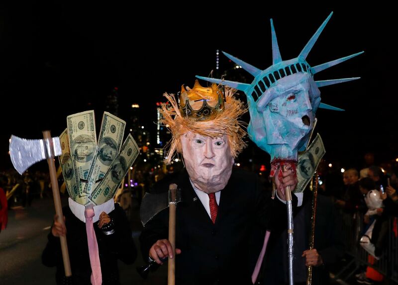 A person dressed as US President Donald Trump marches during the parade. EPA