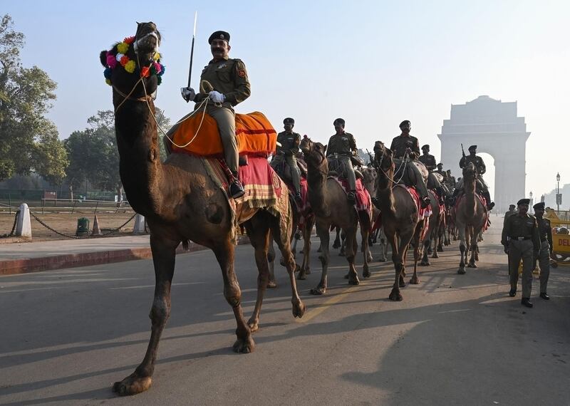 Border security force camel mounted soldiers during a rehearsal for the forthcoming Republic Day parade near India Gate in New Delhi. AFP