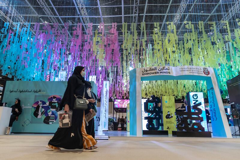 Arabic letters in a futuristic font are suspended above and area where students can undertake quizzes, presented in the form of computer games, to identify their favourite genre.