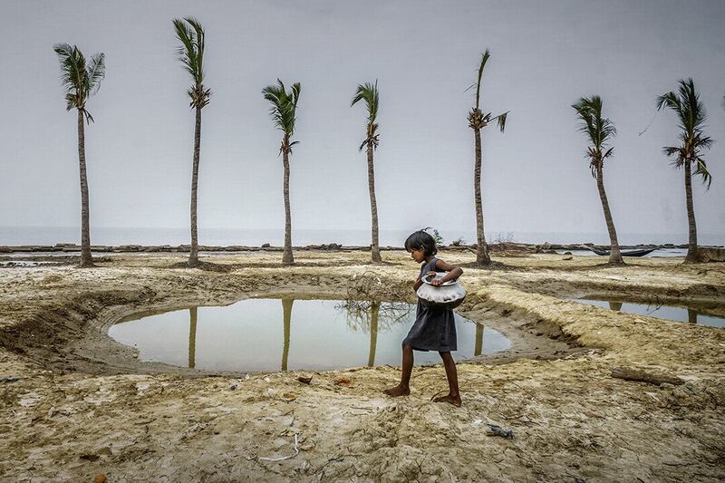 Water Scarcity' by Sujan Sarkar was another shortlisted image, in which a nine-year-old girl carries saltwater for her family to use around the house. Since 2009, when Cyclone Aila struck Mousuni Island, off the Indian coast south of Kolkata, the community has struggled.