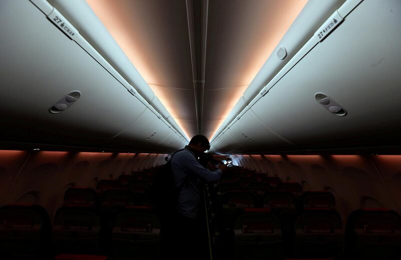 FILE PHOTO: A man takes pictures inside a Norwegian Air Boeing 737-800 during the presentation of Norwegian Air first low cost transatlantic flight service from Argentina at Ezeiza airport in Buenos Aires, Argentina, March 8, 2018. REUTERS/Marcos Brindicci/File Photo