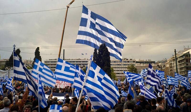 ATHENS, GREECE - FEBRUARY 04: Demonstrators wave Greek national flags during a demonstration February 4, 2018 in Athens, Greece. Protesters gathered in the Greek capital for a rally to protest a potential Greek compromise in a dispute with neighbouring Macedonia over the former Yugoslav republic's official name. (Photo by Milos Bicanski/Getty Images)