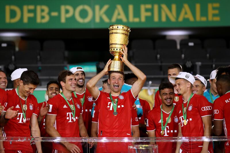 Thomas Mueller lifts trophy. EPA