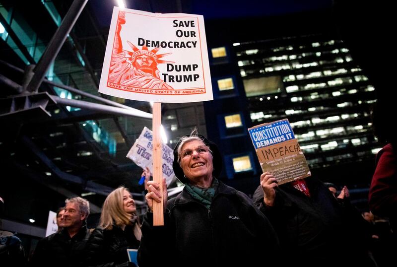 Patricia Crosby of San Francisco patricipates in a demonstration in part of a national impeachment rally, at the Federal Building in San Francisco, California. AFP