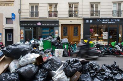 Rubbish piled up on the streets of Paris as waste collectors walked out. Bloomberg 
