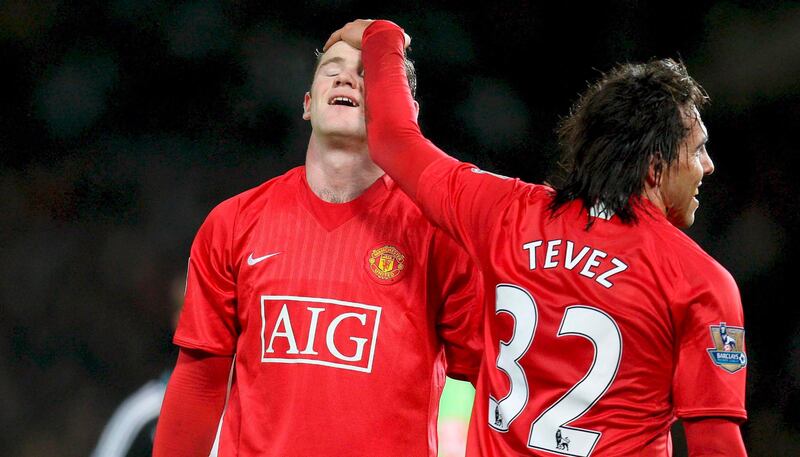 epa02401473 (FILE) A file picture dated 12 January 2008 shows Manchester United player Carlos Tevez (R) in a playful mood with team mate Wayne Rooney during the English Premier League soccer match between Manchester United and Newcastle at Old Trafford, Manchester, north-west England. Manchester United manager Sir Alex Ferguson confirmed on 19 October 2010 that Wayne Rooney says he is 'adamant' that he wants to leave the club. The striker's future had been the subject of speculation for some days and though Ferguson said rumours of a row between the two men were wrong, they would now have to deal with the news.  EPA/MAGI HAROUN UK AND IRELAND OUT *** Local Caption ***  02401473.jpg