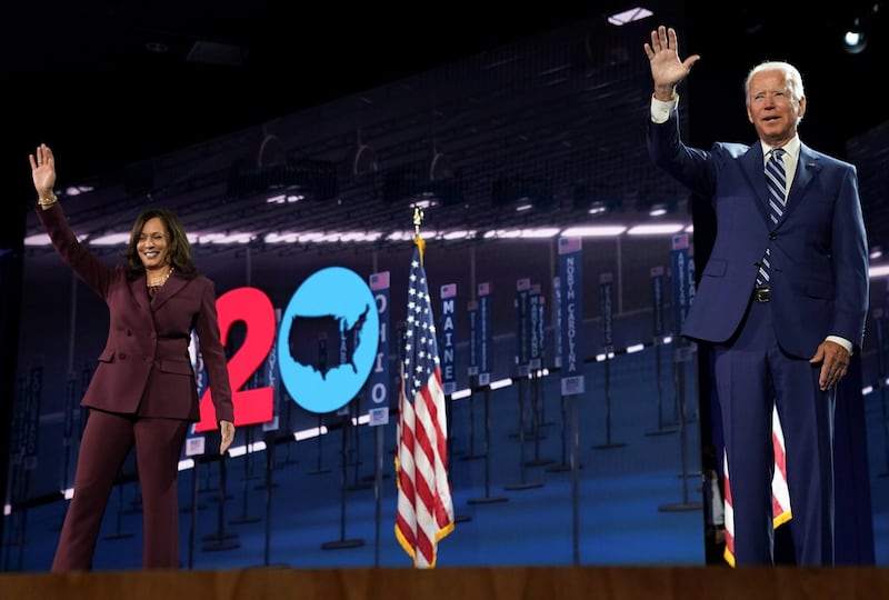 Democratic presidential candidate and former Vice President Joe Biden waves next to U.S. Senator Kamala Harris (D-CA) after she accepted the Democratic vice presidential nomination during an acceptance speech delivered for the largely virtual 2020 Democratic National Convention from the Chase Center in Wilmington, Delaware, U.S. REUTERS