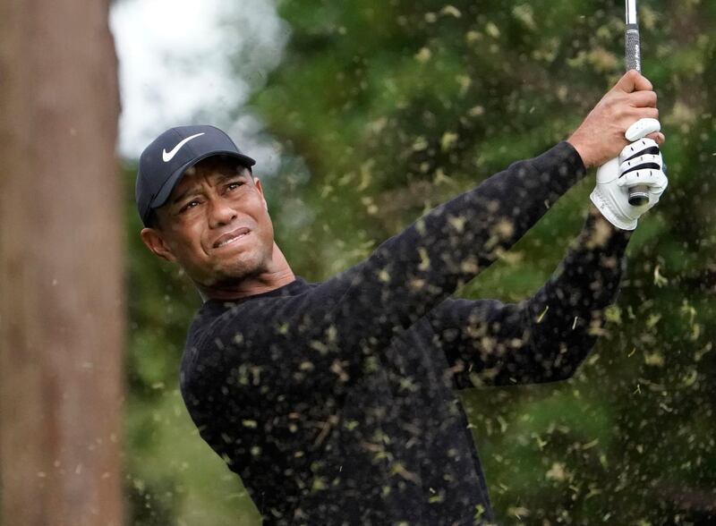 Tiger Woods of the United States watches his tee shot on the 13th hole. AP