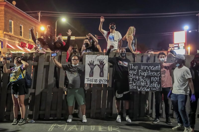 epa08459465 People participate in a protest after curfew near the arrest site of George Floyd, who later died in police custody, in Minneapolis, Minnesota, USA, 01 June 2020. A bystander's video posted online on 25 May appeared to show George Floyd, 46, pleading with arresting officers that he couldn't breathe as an officer knelt on his neck. The unarmed black man later died in police custody.  EPA/TANNEN MAURY