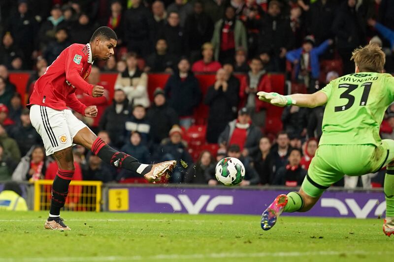 Marcus Rashford scores United's third goal past Charlton goalkeeper Ashley Maynard-Brewer. AP