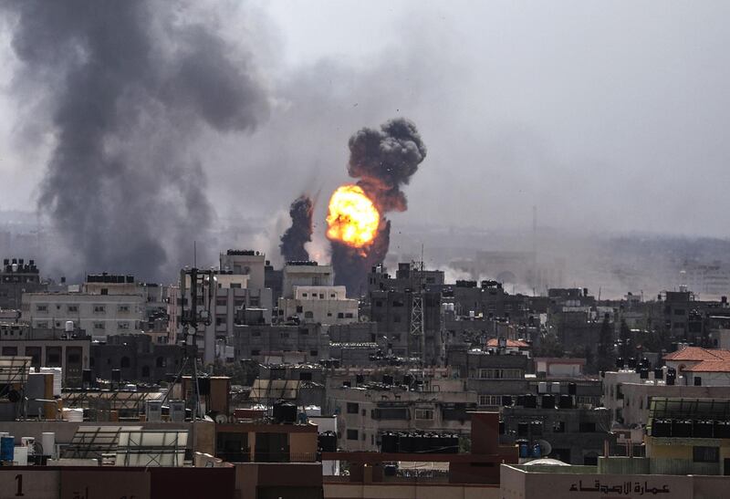 epa07546565 Smoke and flames rise after an Israeli airstrike in Gaza City, 04 May 2019. Reports state five Palestinians were killed, including three in Israeli airstrikes in the Gaza Strip and two during protests after Friday prayer near the border with Israel eastern Gaza Strip. The Israeli army said almost 100 rockets were fired from the strip.  EPA/MOHAMMED SABER