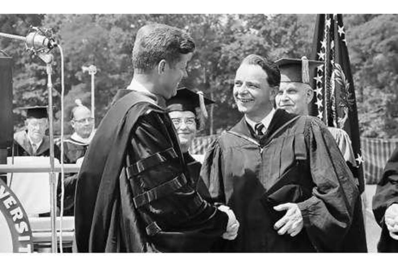 President John Kennedy shakes hands with Robert Byrd at the American University graduation ceremony in Washington in 1963.
