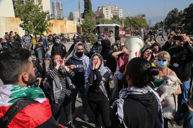 Families of those arrested and anti-government protesters from Tripoli, Beqaa and Beirut shout slogans during protest in front of the military court in Beirut. EPA