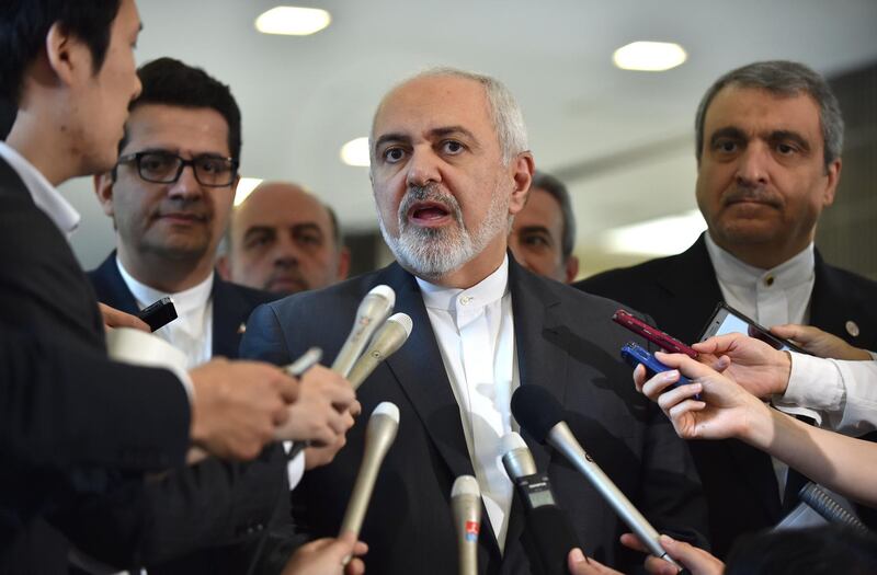 Iranian Foreign Minister Mohammad Javad Zarif (C) answers questions after a meeting with Japanese Foreign Minister Taro Kono at the foreign ministry in Tokyo on May 16, 2019. / AFP / Kazuhiro NOGI
