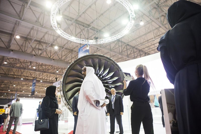 Attendees inspect an aircraft engine on the Rolls-Royce Holdings Plc exhibition stand during the 15th Dubai Air Show at Dubai World Central (DWC) in Dubai, United Arab Emirates, on Monday, Nov. 13, 2017. The biennial Dubai expo is an important venue for both manufacturers to secure deals for their biggest and most expensive jetliners. Photographer: Natalie Naccache/Bloomberg