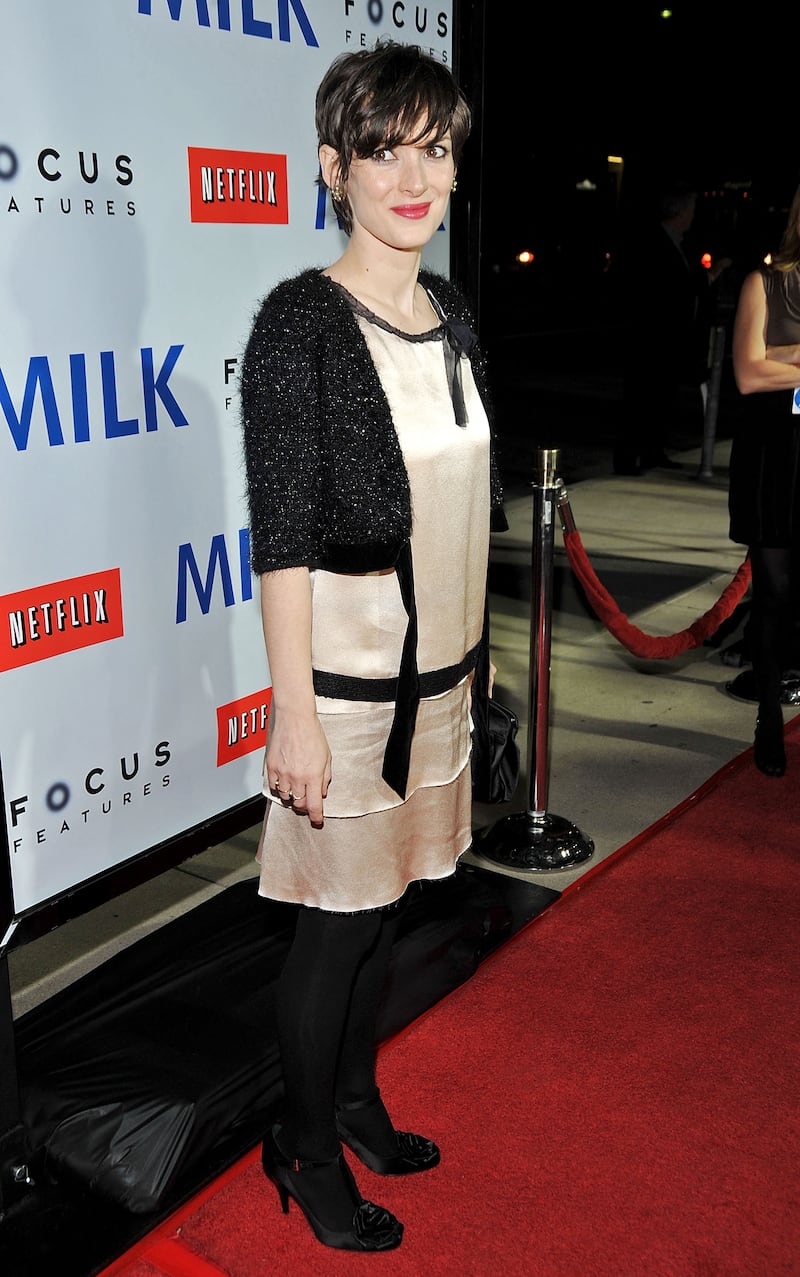 Winona Ryder in a cream dress with black edging arrives at the Los Angeles premiere of Focus Features' 'Milk', held at the Academy of Motion Picture Arts and Sciences on November 13, 2008 in Beverly Hills, California. Getty