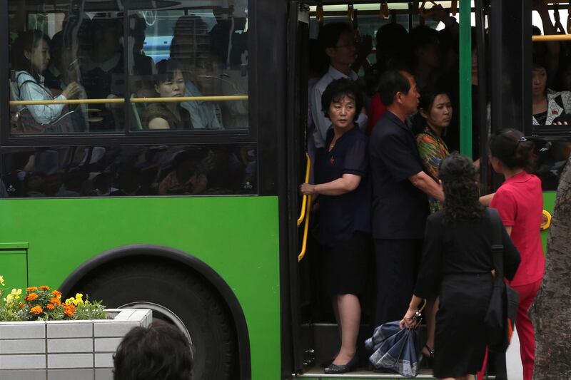 People board a packed public bus in Pyongyang, North Korea, Wednesday, June 13, 2018. (AP Photo/Dita Alangkara)