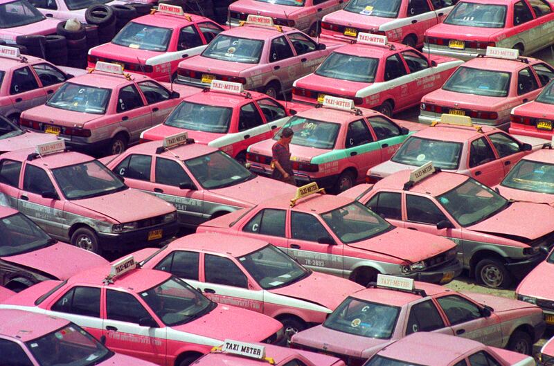 Past imperfect. This 1997 photo shows a taxi driver walking through hundreds of taxis taken out of service to save operating costs in Bangkok, Thailand. Asia's recovery from its crisis has lessons for other countries today. Sakchai Lalit : AP