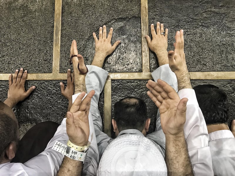 Muslim Hajj pilgrims touch Kaaba's wall and pray around the holy Kaaba at the Grand Mosque in Mecca, Saudi Arabia. EPA