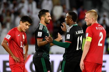 United Arab Emirates' forward Ahmed Khalil (C-R) is congratulated United Arab Emirates' forward Ali Mabkhout (C-L) during the 2019 AFC Asian Cup Round of 16 football match between UAE and Kyrgyzstan at the Zayed Sports City Stadium in Abu Dhabi on January 21, 2019. / AFP / Khaled DESOUKI