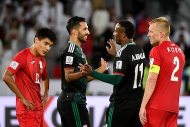 United Arab Emirates' forward Ahmed Khalil (C-R) is congratulated United Arab Emirates' forward Ali Mabkhout (C-L) during the 2019 AFC Asian Cup Round of 16 football match between UAE and Kyrgyzstan at the Zayed Sports City Stadium in Abu Dhabi on January 21, 2019. / AFP / Khaled DESOUKI