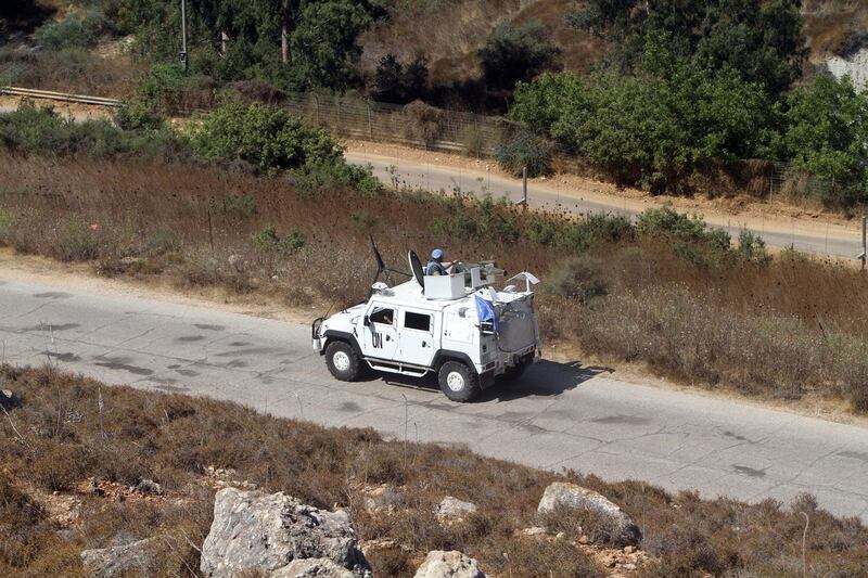 Spanish UN peacekeepers patrol the Lebanese side of the Lebanese-Israeli border in the southern village of Kfar Kila. AP