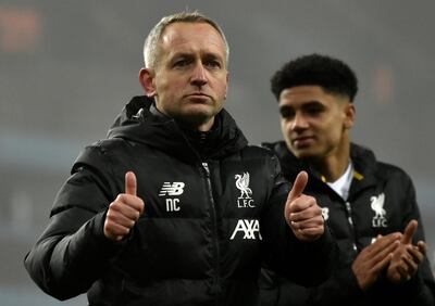 Liverpool's Under 23 coach Neil Critchley, left, leaves the field at the end of the English League Cup quarter final soccer match between Aston Villa and Liverpool at Villa Park in Birmingham, England, Tuesday, Dec. 17, 2019. (AP Photo/Rui Vieira)