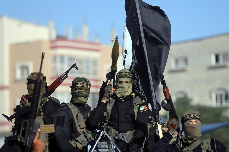 Palestinian Islamic jihad militants take part in a military show marking the 32nd anniversary of the organisation's founding, in the central Gaza Strip October 3, 2019. REUTERS/Ibraheem Abu Mustafa