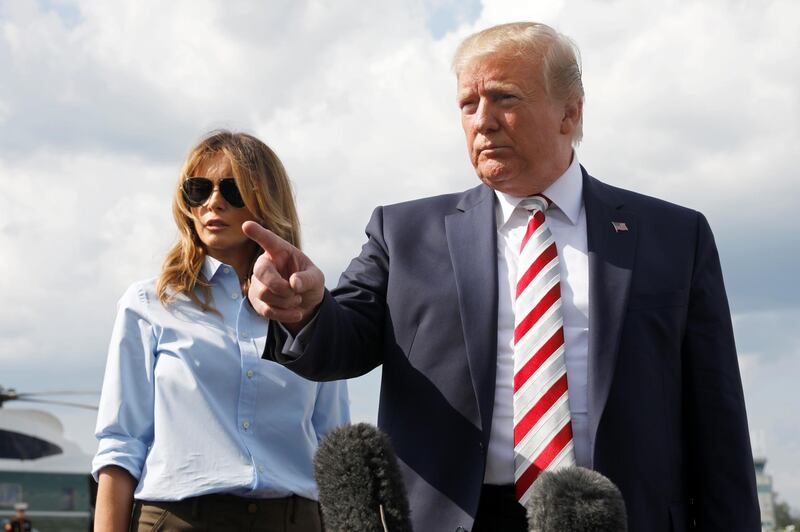REFILE - QUALITY REPEAT U.S. President Donald Trump speaks to reporters about the mass shootings in Texas and Ohio before boarding Air Force One at Morristown municipal airport en route to Washington after a weekend in Bedminster,  New Jersey, U.S., August 4, 2019. REUTERS/Yuri Gripas
