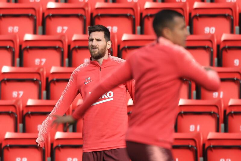 Barcelona captain Lionel Messi, left, takes part in training at Anfield ahead of the Uefa Champions League semi-final, second leg against Liverpool. AFP