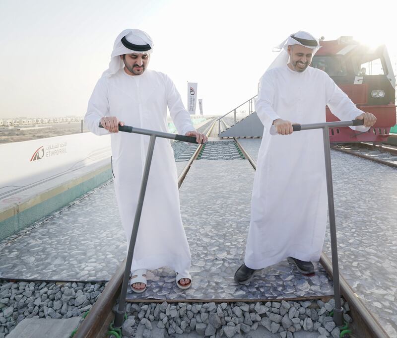 Sheikh Maktoum bin Mohammed with Sheikh Theyab bin Mohammed of Etihad Rail. The segment of line is a key part of Etihad Rail's network that will carry passengers and freight between the emirates and eventually across the country.