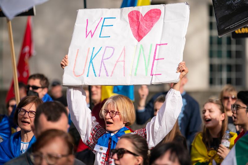 People outside Downing Street, London, take part in a demonstration against the Russian invasion of Ukraine. PA